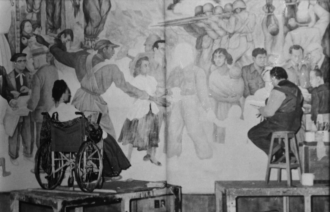 frida kahlo e diego rivera davanti a un murale